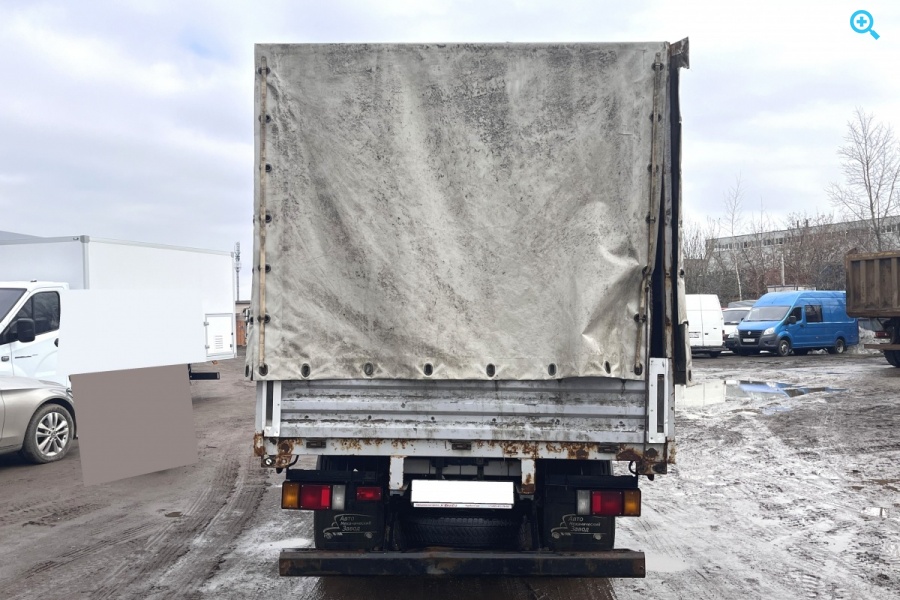 Грузовик бортовой тентованный Isuzu Elf 